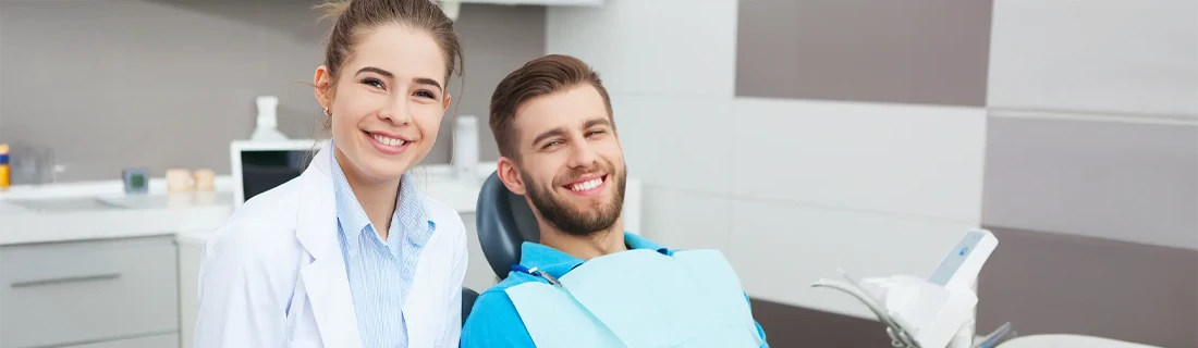 Dentist Feeding Hills MA Dentist and Patient Smiling Dentist and Patient Smiling while preparing for a check-up